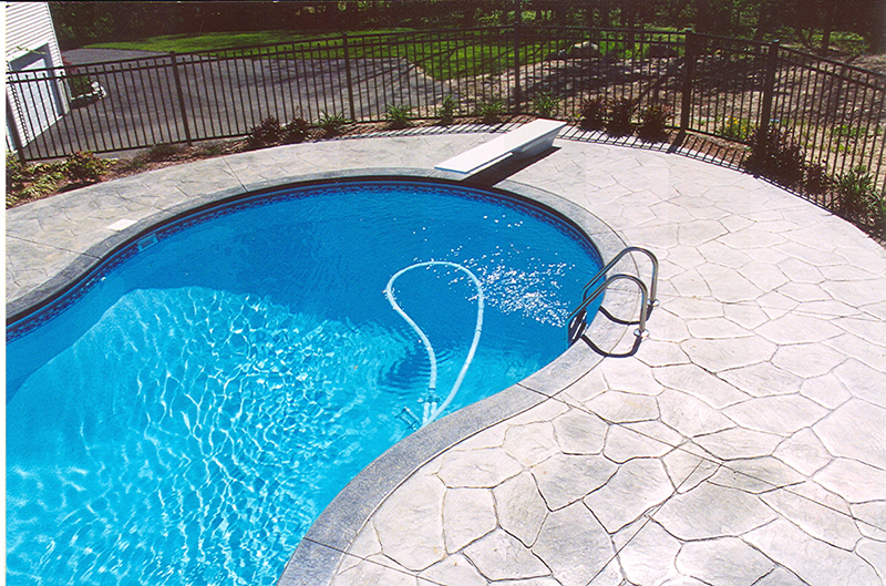 Swimming pool and stamped concrete project example 90